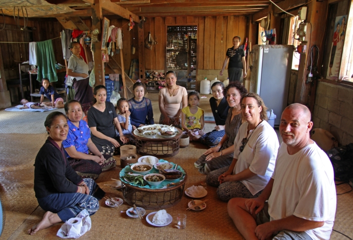 We sit with the village women and enjoy the delicious food.